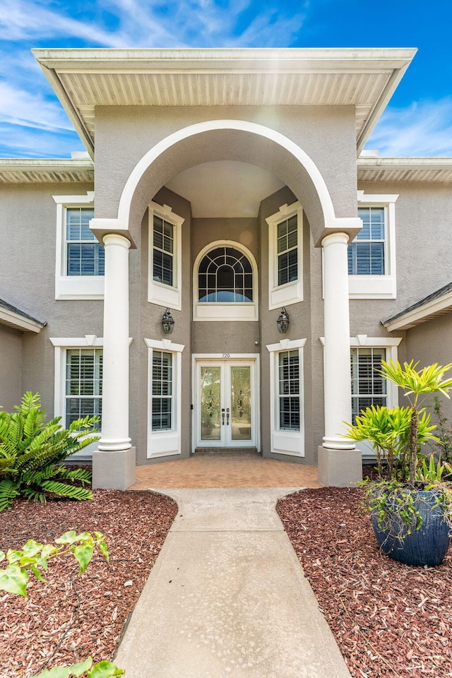 entrance to property featuring french doors