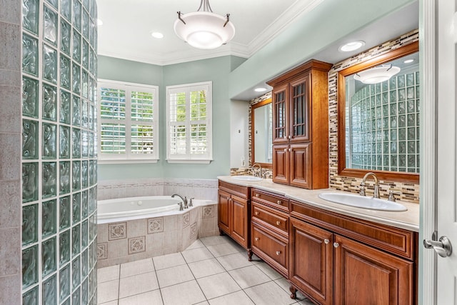 bathroom with vanity, tile patterned flooring, tiled bath, and crown molding