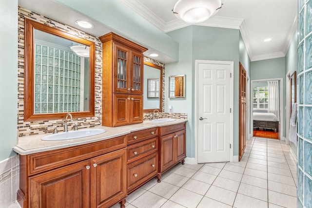 bathroom featuring ornamental molding, tasteful backsplash, vanity, and tile patterned floors