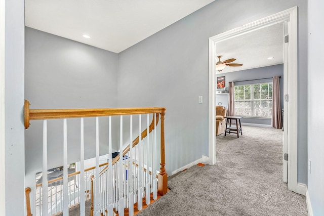 hallway with light carpet