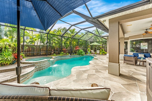 view of pool featuring an outdoor hangout area, a lanai, a patio area, ceiling fan, and an in ground hot tub