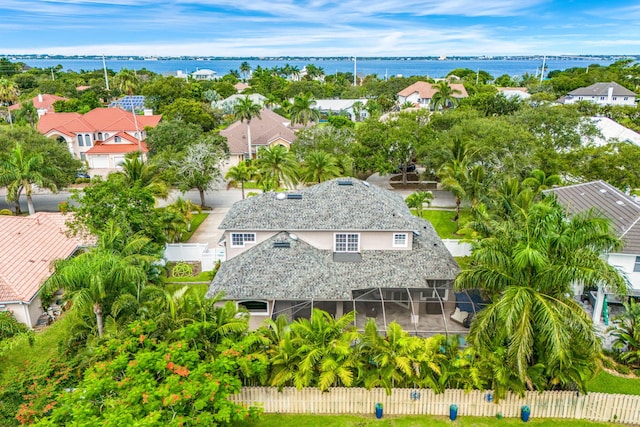 birds eye view of property with a water view