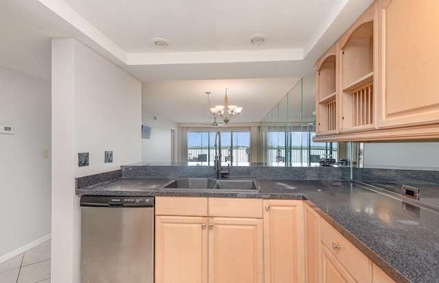 kitchen featuring a chandelier, kitchen peninsula, light brown cabinetry, and stainless steel dishwasher