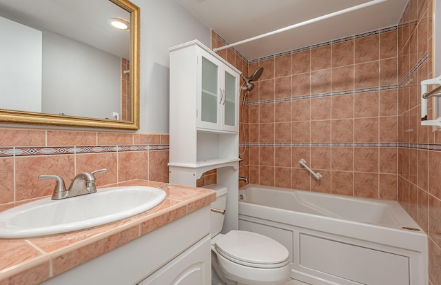 full bathroom featuring tasteful backsplash, tile walls, toilet, vanity, and tiled shower / bath combo