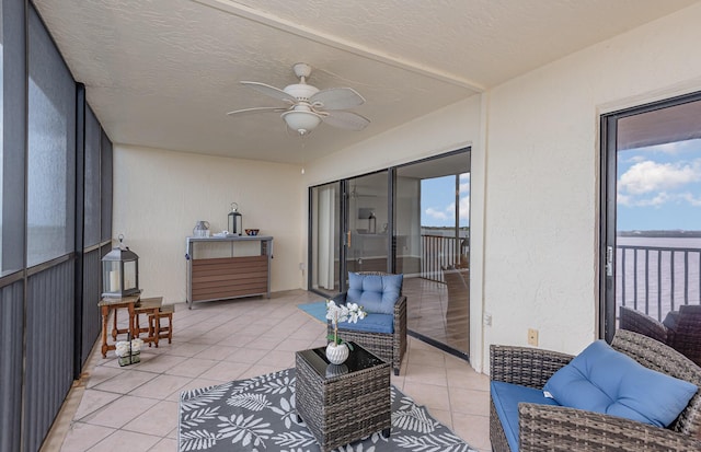 sunroom with ceiling fan and a healthy amount of sunlight