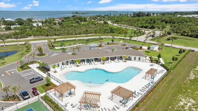 birds eye view of property with a water view