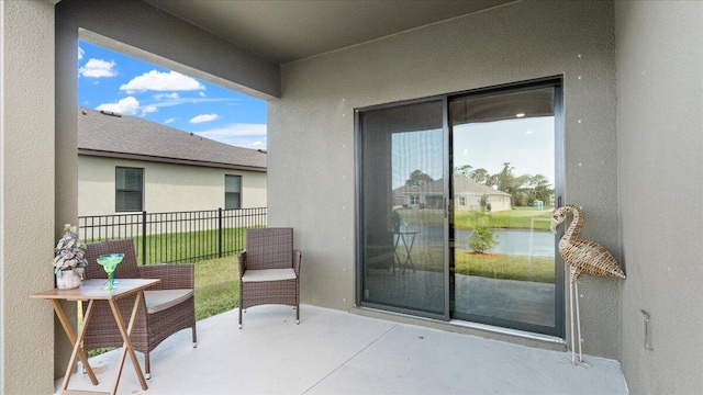 balcony featuring a water view