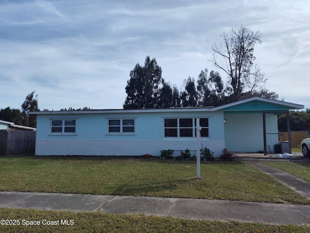 ranch-style home with a front lawn