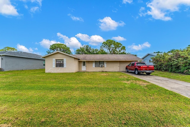 ranch-style house with a garage and a front yard