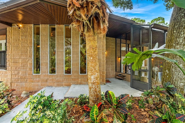 doorway to property featuring a patio area