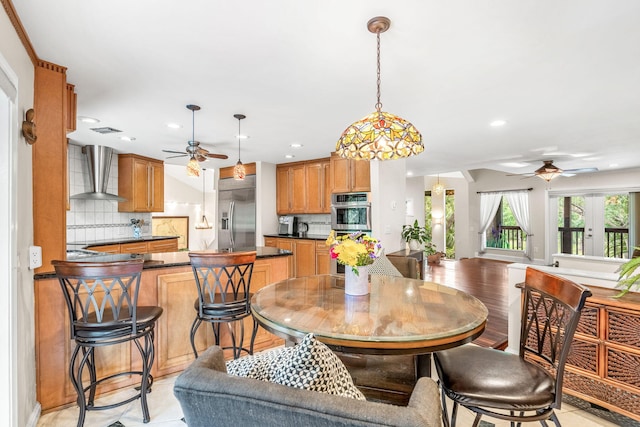 dining area with ceiling fan