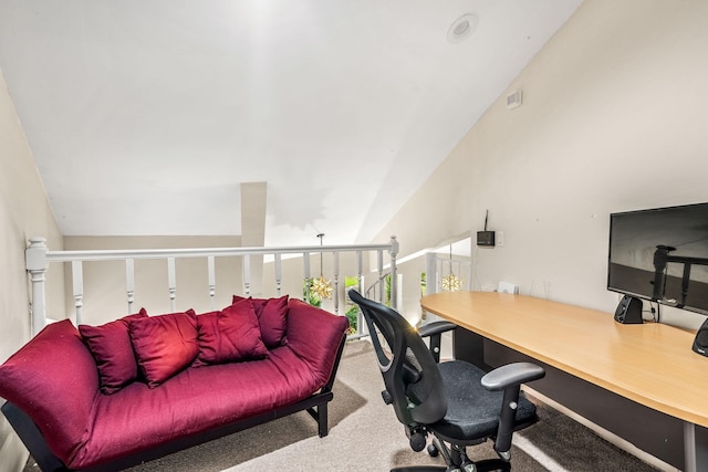 home office featuring lofted ceiling and carpet