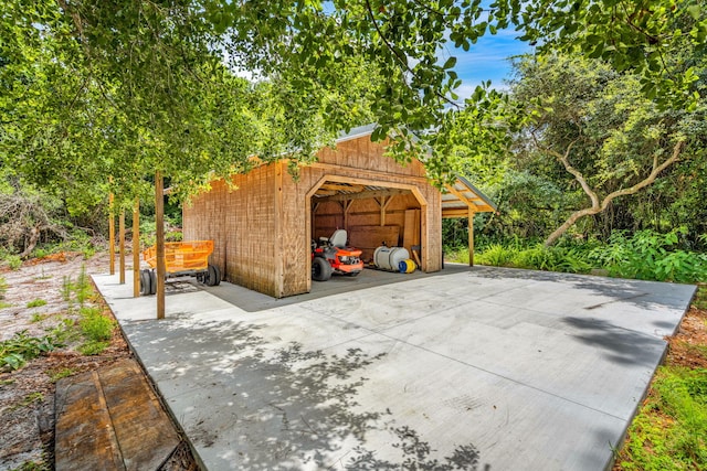 view of patio / terrace featuring an outbuilding