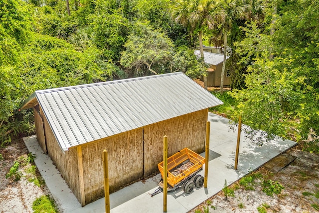 view of outdoor structure featuring a fire pit