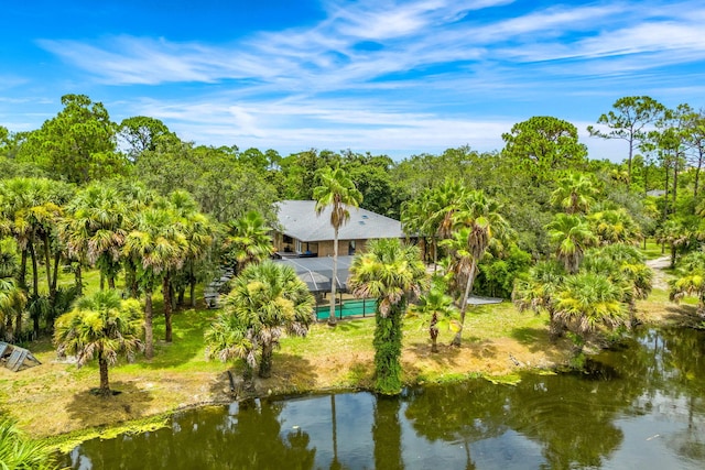 birds eye view of property with a water view