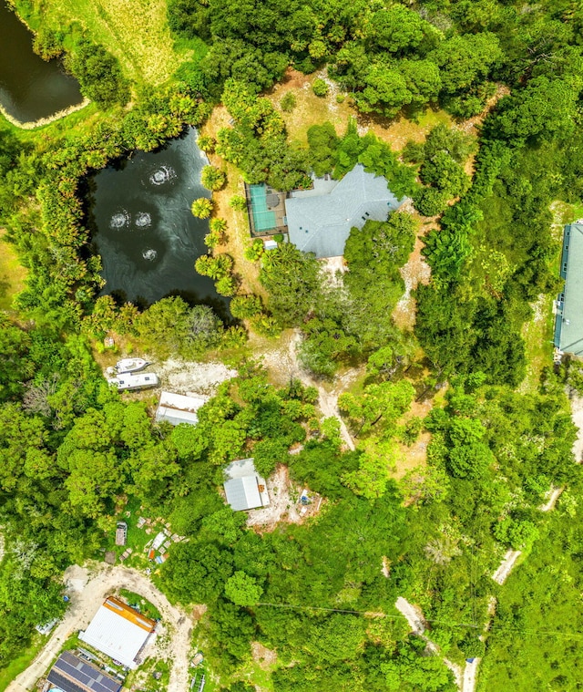 birds eye view of property featuring a water view