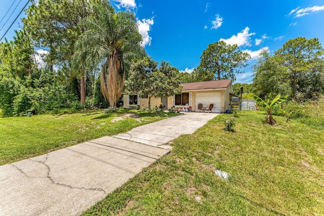 ranch-style house with a garage and a front yard