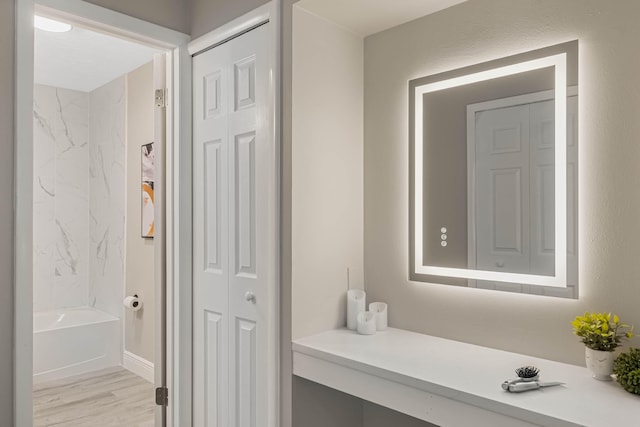 bathroom featuring a tub and hardwood / wood-style floors