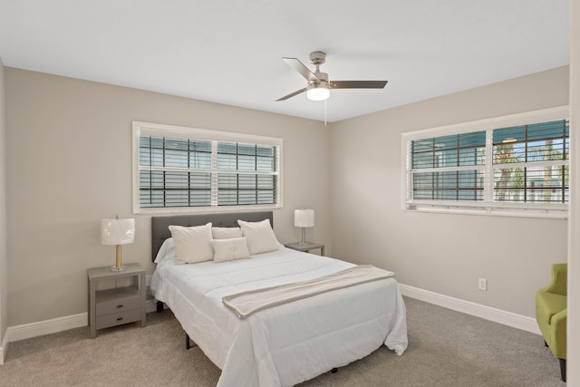 bedroom featuring light colored carpet and ceiling fan