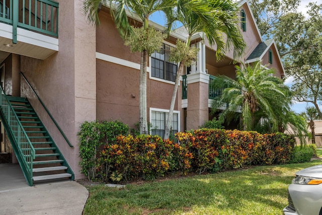 7667 N Wickham Rd Unit 1515, Melbourne, FL 32940 - view of building exterior with stairs