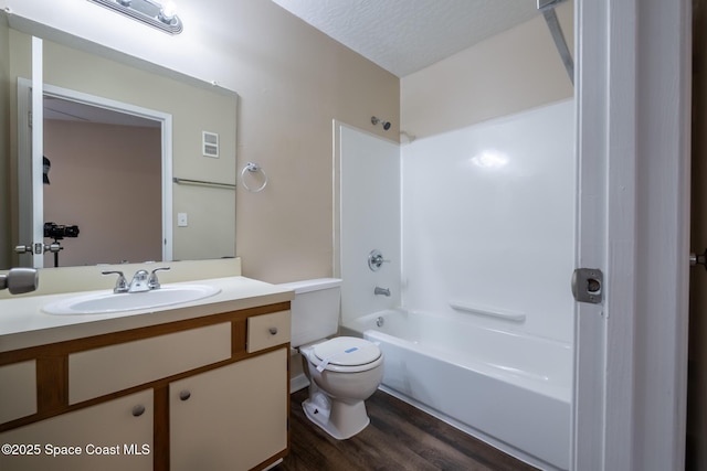 7667 N Wickham Rd Unit 1515, Melbourne, FL 32940 - full bath featuring toilet, wood finished floors, vanity, and shower / bathtub combination