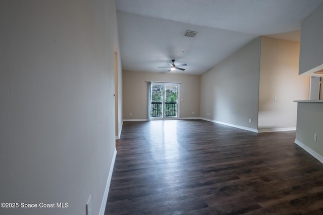7667 N Wickham Rd Unit 1515, Melbourne, FL 32940 - spare room featuring ceiling fan, baseboards, dark wood-style floors, and lofted ceiling