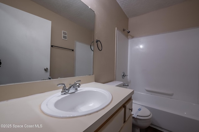 7667 N Wickham Rd Unit 1515, Melbourne, FL 32940 - full bath with toilet, vanity,  shower combination, and a textured ceiling