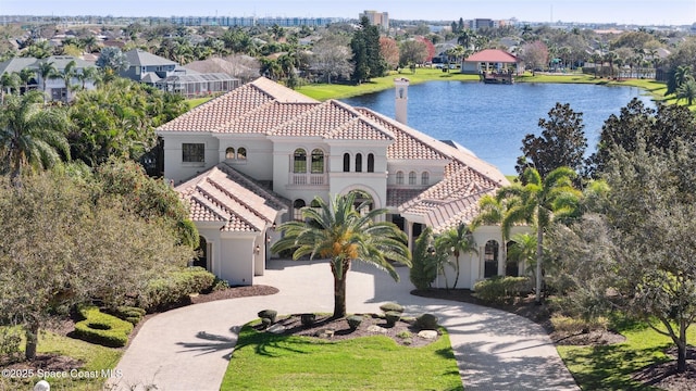 birds eye view of property with a water view