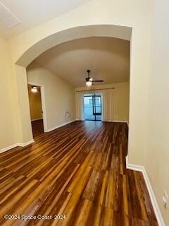 unfurnished living room featuring dark hardwood / wood-style flooring and ceiling fan