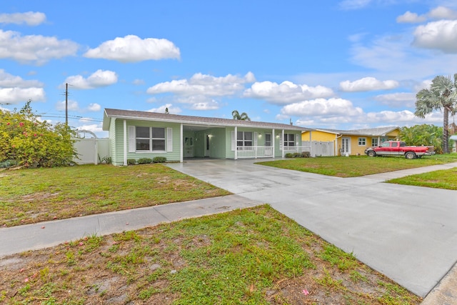 single story home with a carport and a front lawn