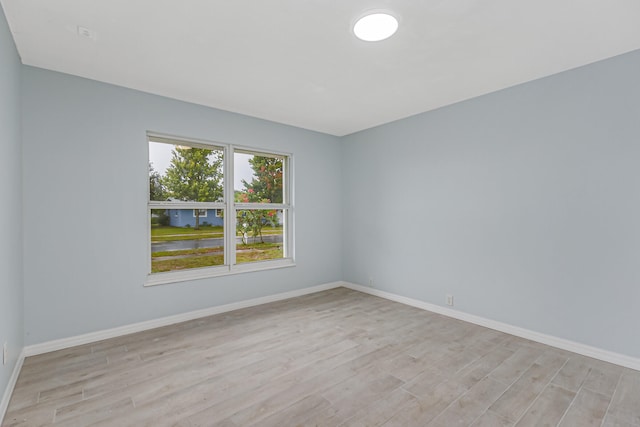 spare room with light wood-type flooring