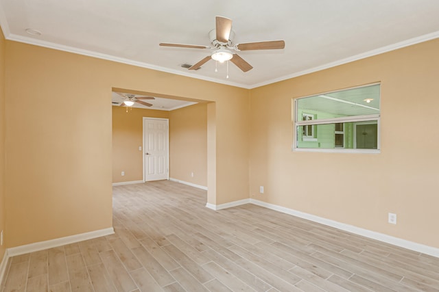 empty room with ornamental molding, light wood-type flooring, and ceiling fan