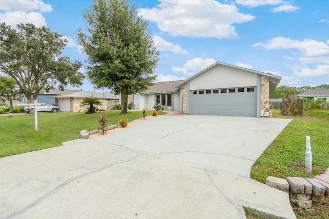 ranch-style home featuring a garage and a front lawn