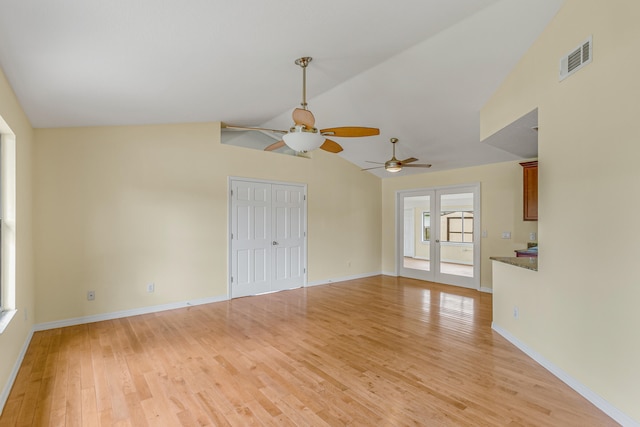 unfurnished living room with ceiling fan, light hardwood / wood-style flooring, and vaulted ceiling