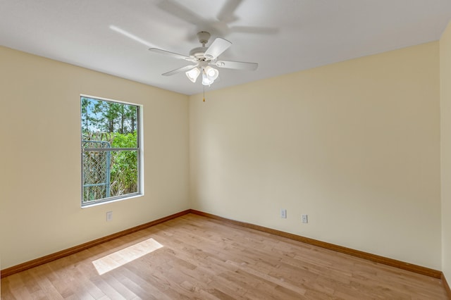 empty room with light hardwood / wood-style flooring and ceiling fan