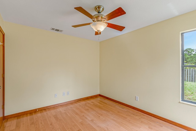 empty room with light hardwood / wood-style flooring and ceiling fan