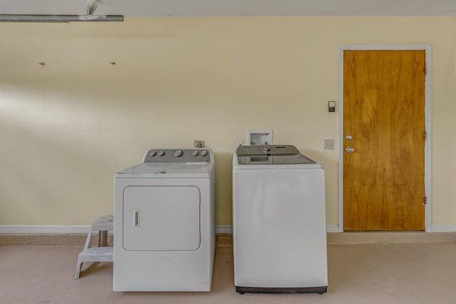 washroom featuring washer and clothes dryer