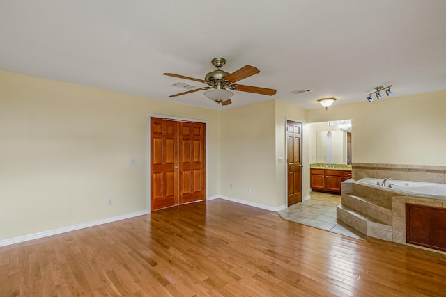 interior space featuring ceiling fan and light hardwood / wood-style floors