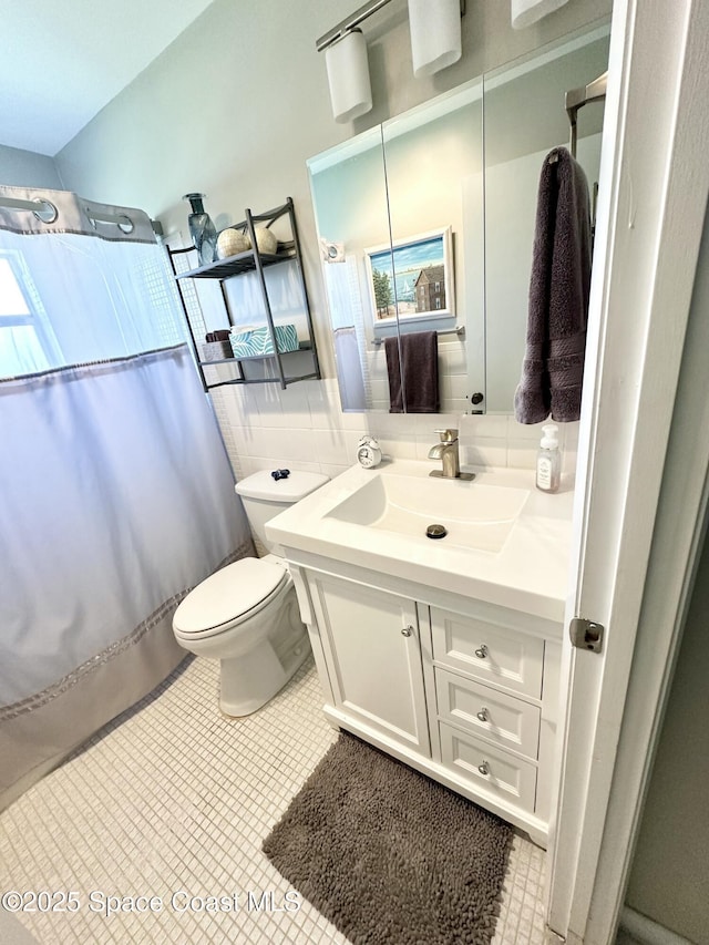 bathroom with vanity, a shower with curtain, and toilet