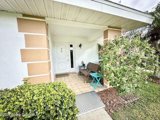 property entrance with a patio area