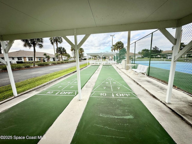 surrounding community with tennis court