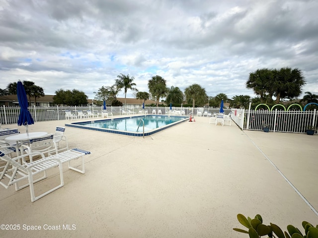 view of swimming pool featuring a patio