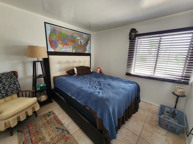 bedroom with light tile patterned flooring