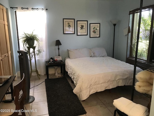 bedroom featuring light tile patterned floors