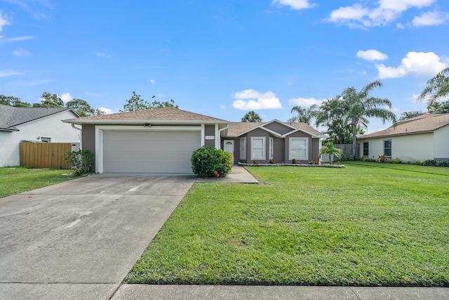 ranch-style house with a garage and a front lawn