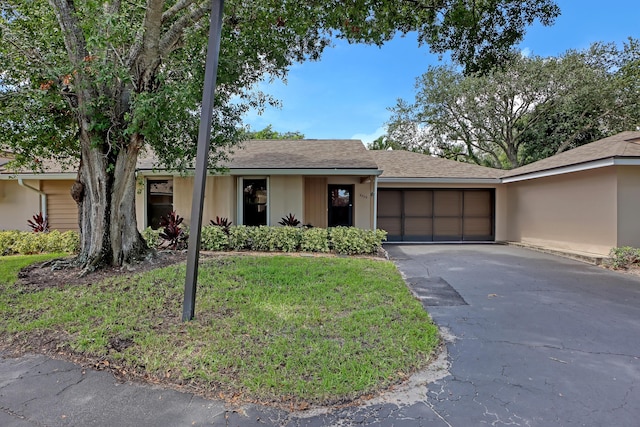 ranch-style home with a garage