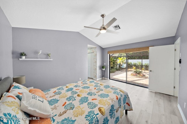 6209 S Mirror Lake Dr Unit 7, Sebastian, FL 32958 - bedroom with access to exterior, lofted ceiling, wood finished floors, ceiling fan, and baseboards