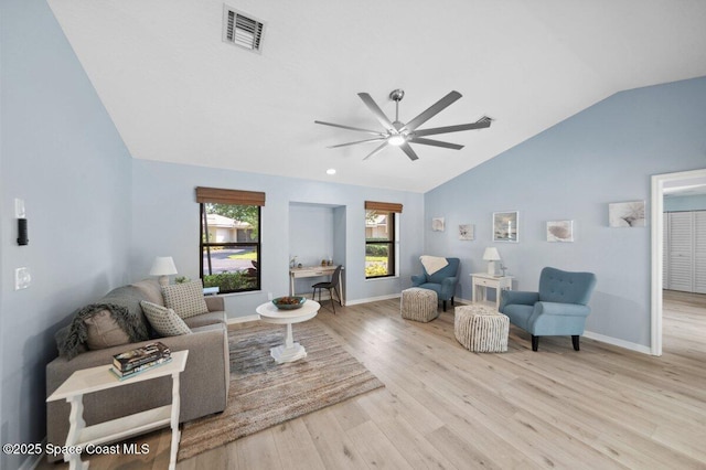 6209 S Mirror Lake Dr Unit 7, Sebastian, FL 32958 - living area featuring vaulted ceiling, a ceiling fan, wood finished floors, and baseboards