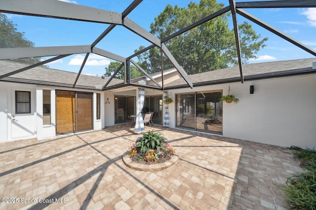 6209 S Mirror Lake Dr Unit 7, Sebastian, FL 32958 - back of house with a patio area, roof with shingles, a lanai, and stucco siding