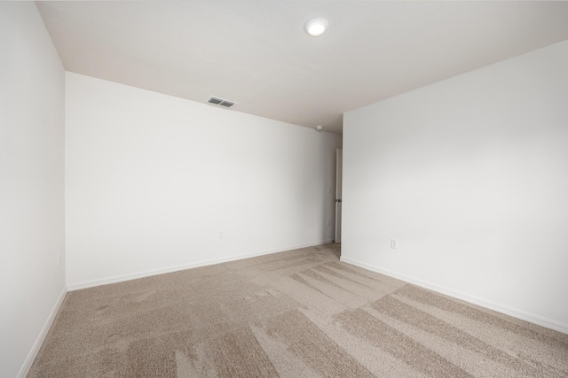 empty room featuring carpet flooring